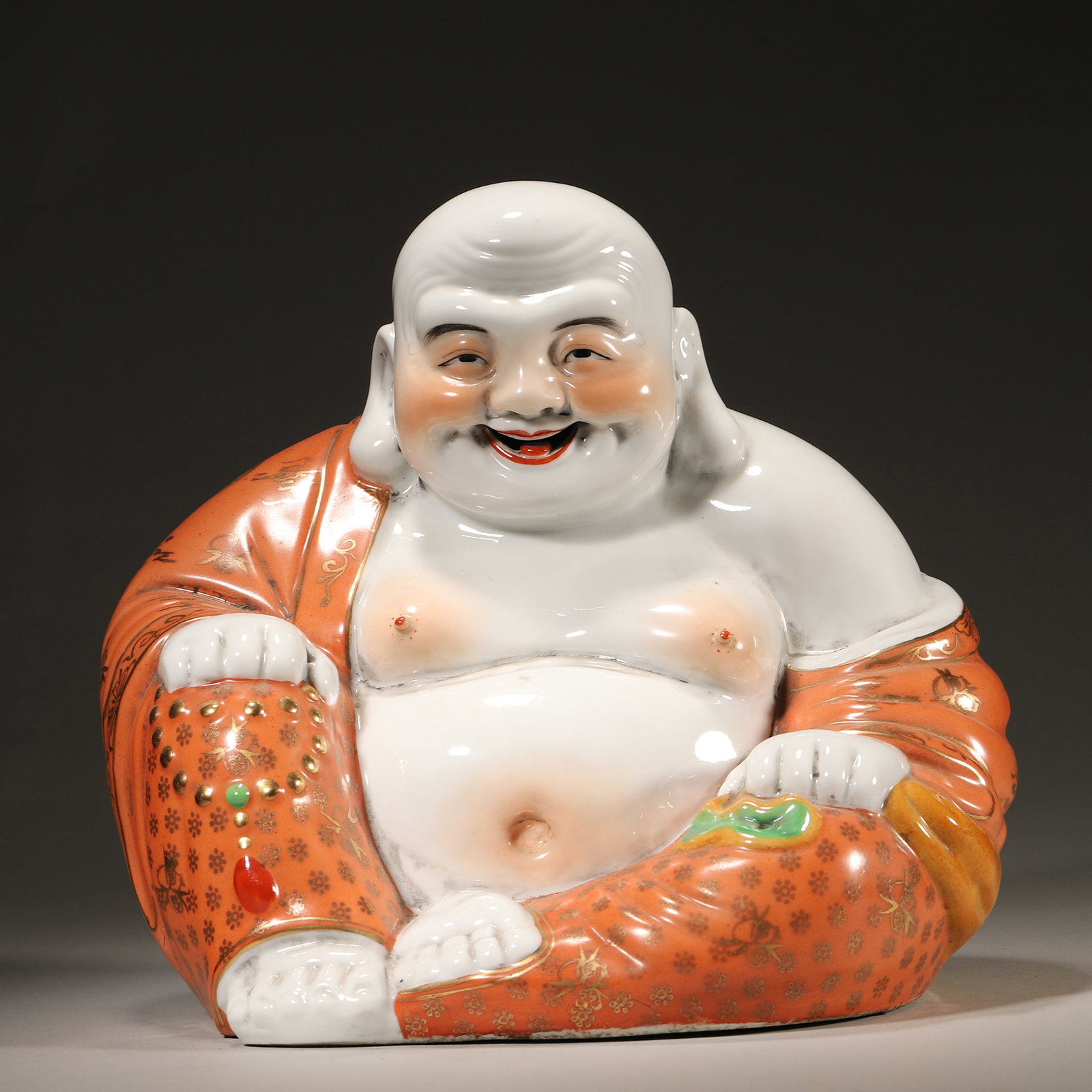 A CORAL-RED AND GILT FIGURE OF MAITREYA (1 of 6)