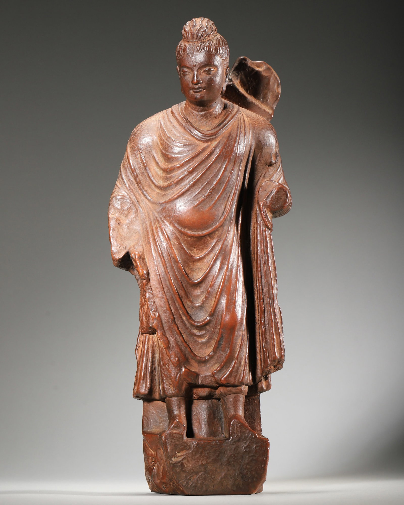 A GANDHARA-STYLE RED-CLAY STANDING BUDDHA (1 of 7)