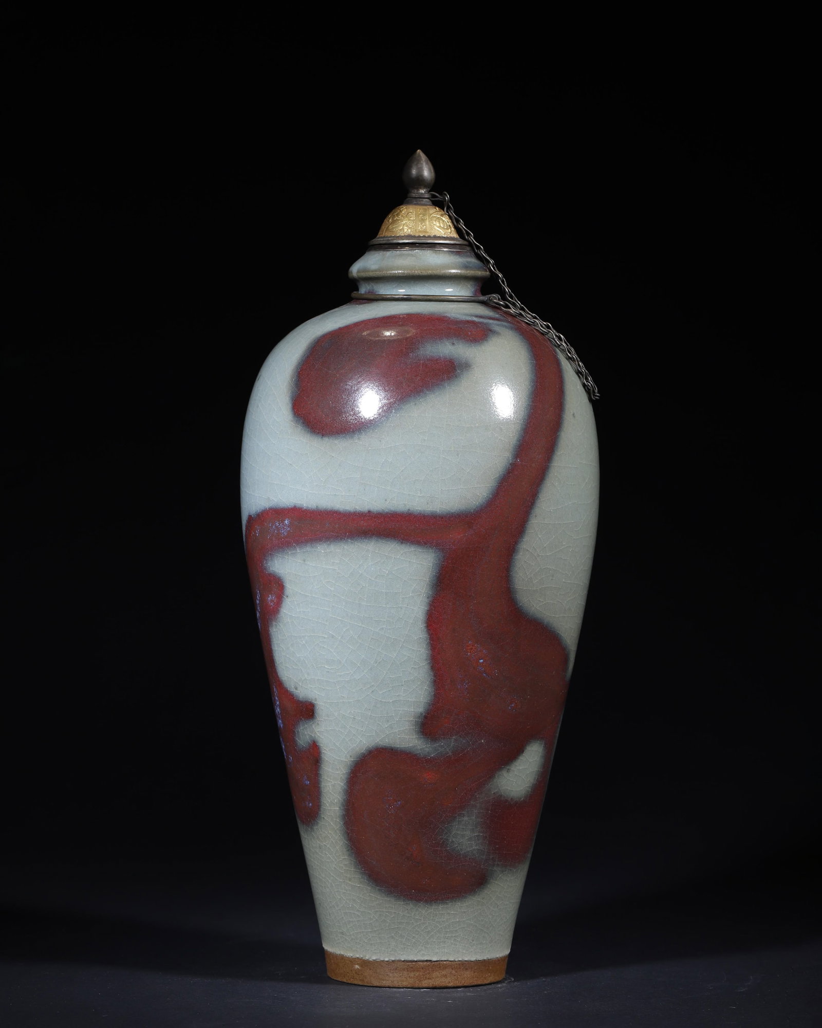 A JUN-TYPE SKY-BLUE AND PURPLE-GLAZED MEIPING WITH GILT-METAL COVER: A meiping-form porcelain vase covered in a milky sky-blue Jun-type glaze with rose-purple flambe decoration, fitted with a later gilt-metal cover bearing an inscription described in the source as