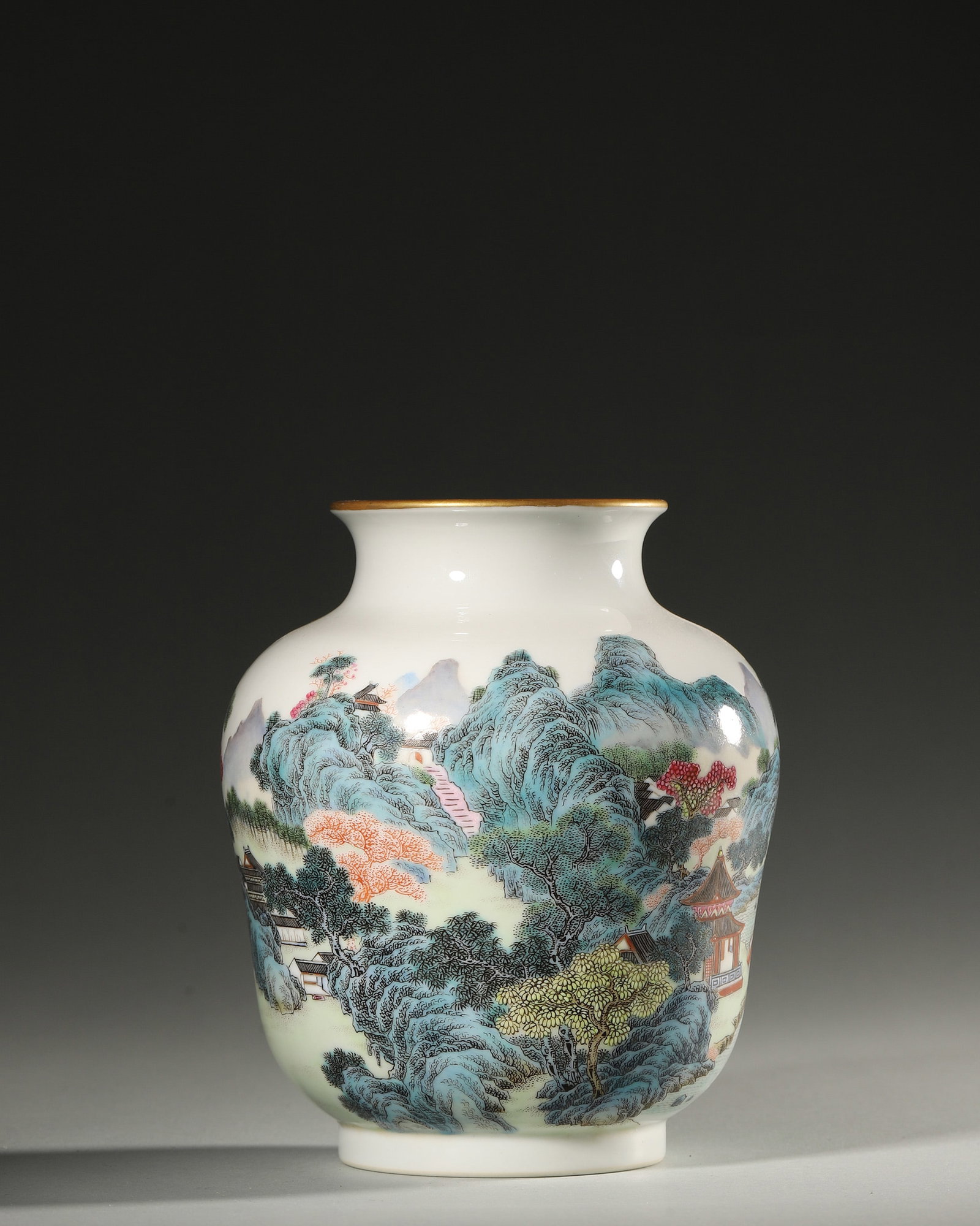 A POLYCHROME LANDSCAPE PORCELAIN JAR: A polychrome porcelain jar decorated with a landscape. Diam. 13 cm; Ht. 14.5 cm.