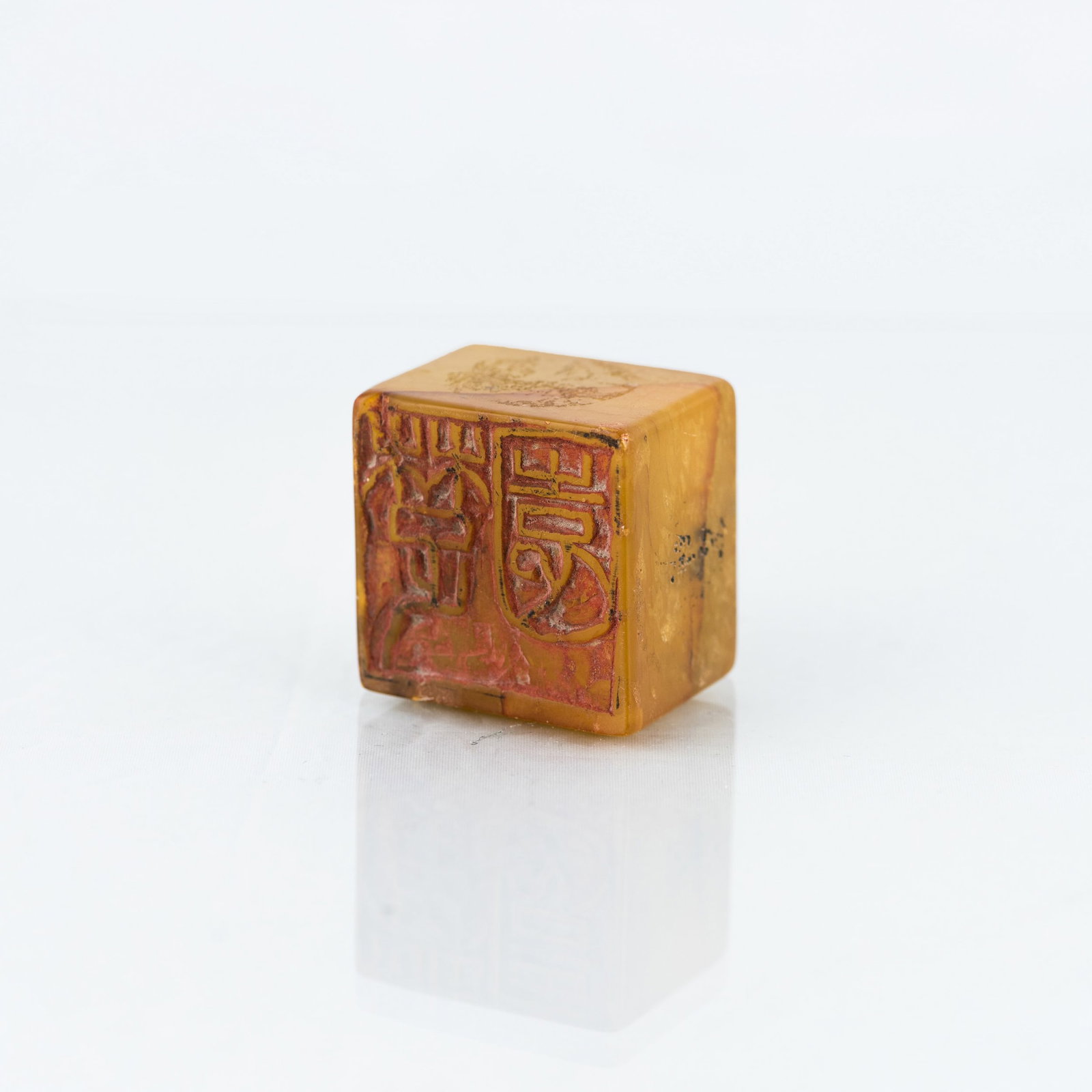 CHINESE SHOUSHAN SOAPSTONE SEAL: Chinese Shoushan soapstone seal of square form and yellow tone, with Chinese calligraphic characters on the base. 1.18"h x 1.57"w x 1.57"l (3 x 4 x 4 cm)
