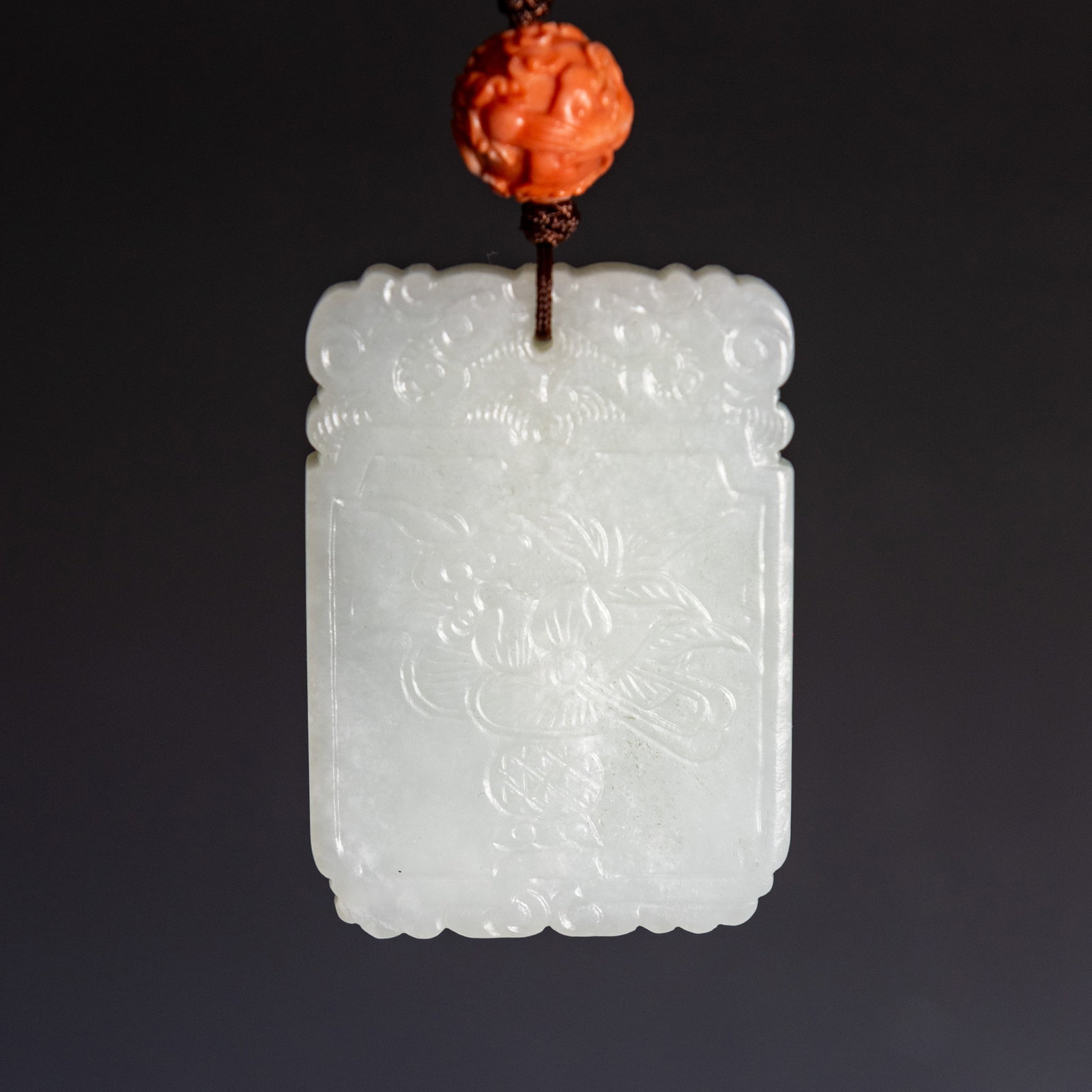 A CHINESE CARVED WHITE JADE PLAQUE (1 of 7)
