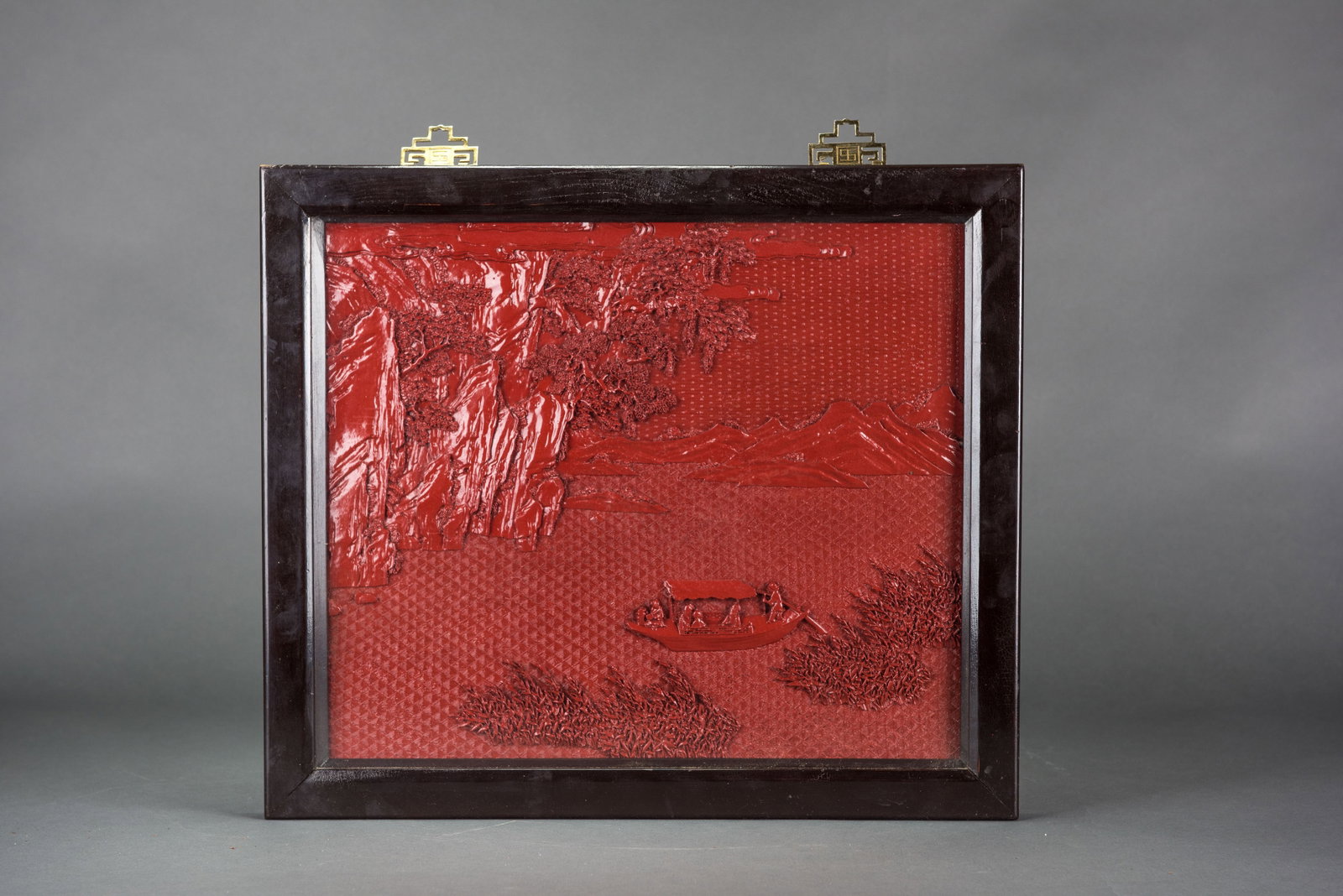 A CARVED CINNABAR LACQUER PANEL, FRAMED - 2