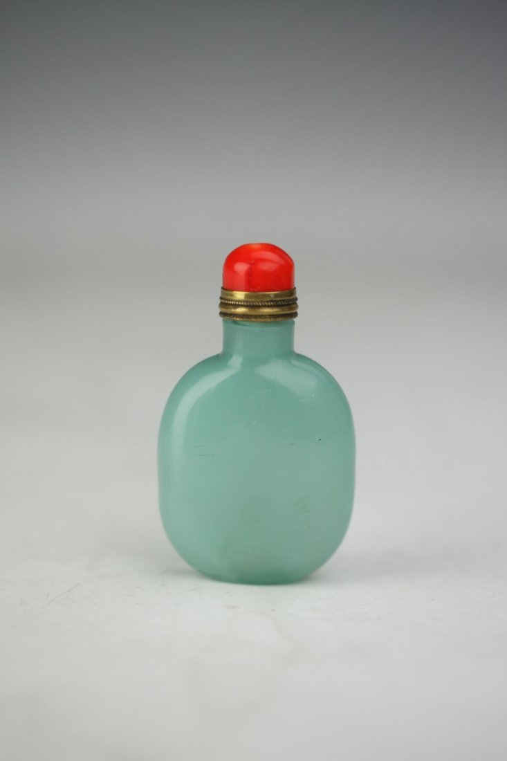 Chinese Peking Glass Snuff Bottle: Chinese Peking Glass snuff bottle of compressed form with scarlett cap and gold detailing. Light Robin's egg blue, elegant in its simplicity of form. Height 3"