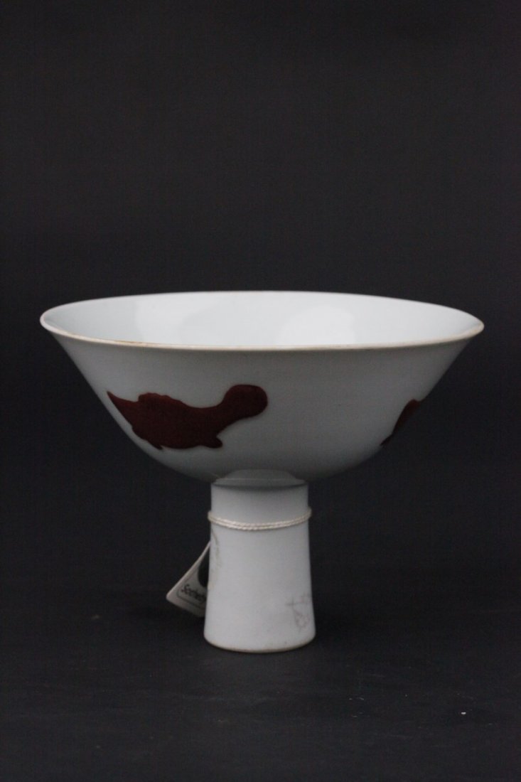 Chinese Famille Verte Porcelain Stem Cup: Luminous Chinese Famille verte porcelain stem cup with primitive marine creature motif. Slightly flared stem features period seal. Diameter 6" Height 5" Provenance Sotheby's.