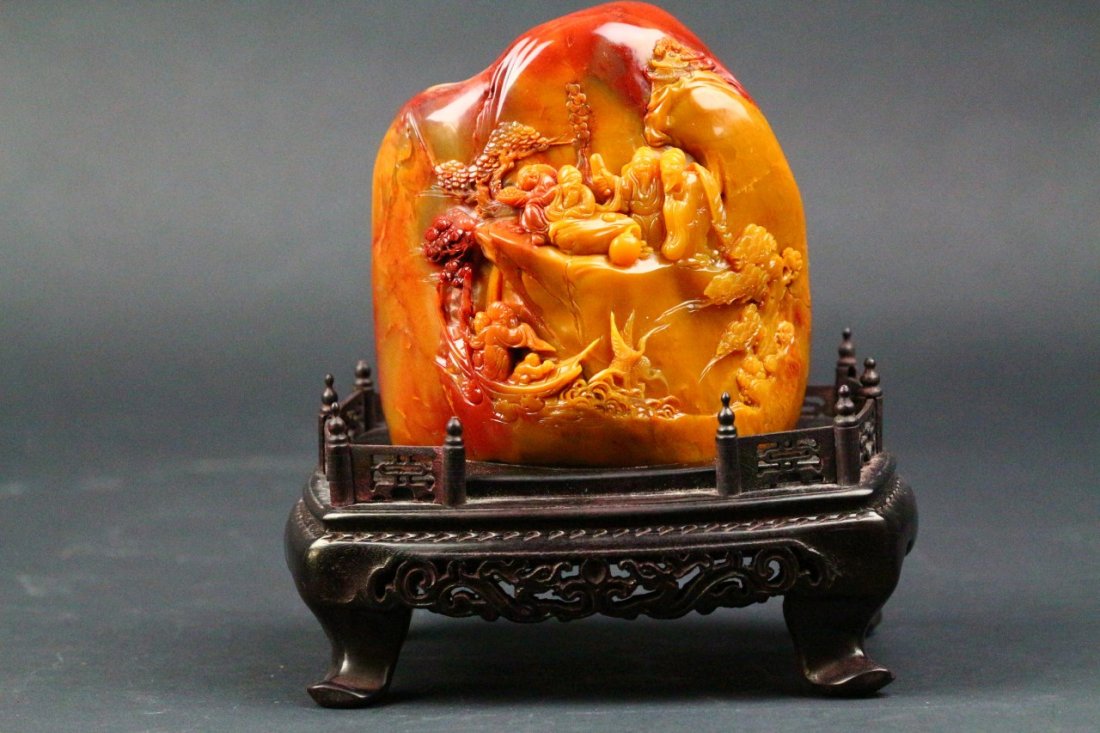 Chicken Blood & Yellow Color "San Bo Dong" Shoushan Sto: Chicken Blood & Yellow Color "San Bo Dong" Shoushan Stone, carving of immortals with hardwood stand. Length 4.5" Width 3.5" Height 5"
