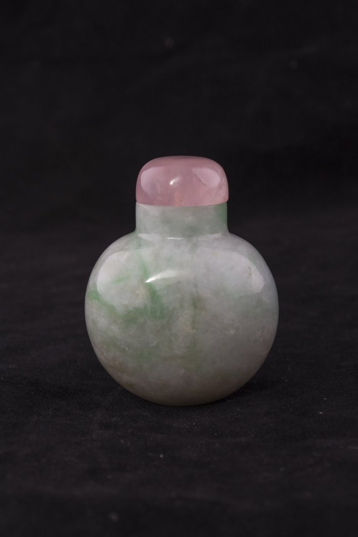Chinese Jadeite Jade Snuff Bottle: Luminous white Jade snuff bottle of compressed form with green and russet suffusions and translucent rose pink cap. Height 2.25"