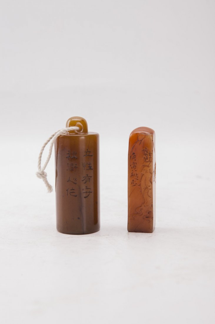 Two Carved Chinese Soapstone Seals: Pair of carved soapstone seal stamps, one of cylindrical form and one of rectangular form with rounded top edge, both with Chinese inscription. Height 3.25" (Tallest)