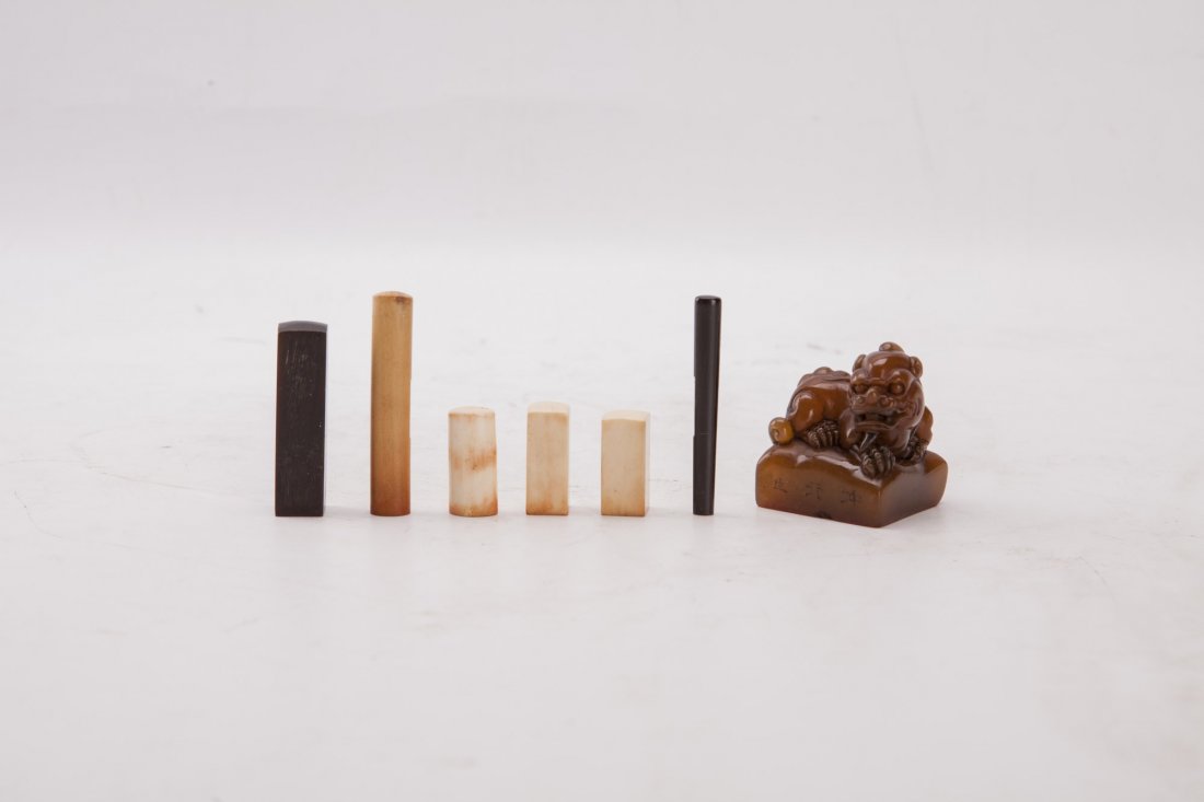 Group of Seven Assorted Wooden and Soapstone Seals: Group of seven seal stamps, in various shapes and sizes, consists of one seal stamp of flattened square form surmounted with a mythological creature, three seal stamps of simple rectangular form and t