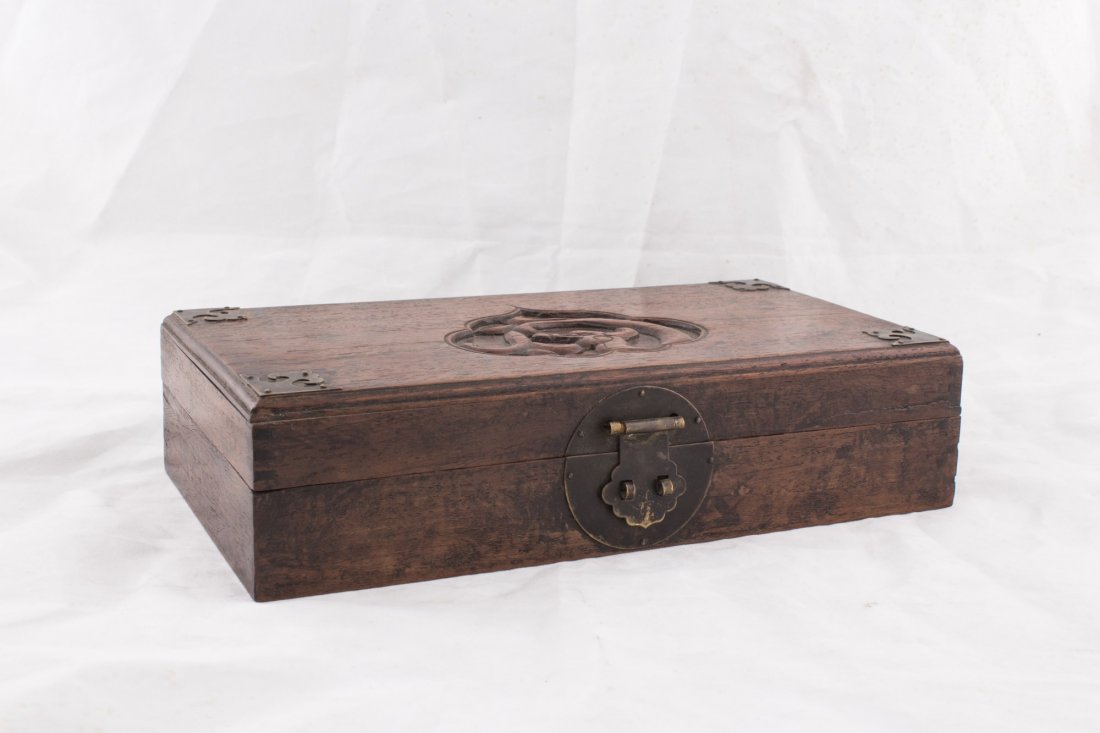 Wood Oriental Treasure Box: Wooden Oriental Treasure Box with brass lockets and clasps. Featuring abstract female figure under ponderous tree branch. Length 11" Width 5.75" Height 2.75"