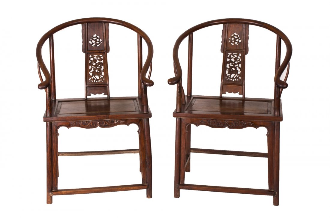 A Pair of Hardwood Or Rosewood Chair: A pair of wood chair, each of square shape, in dark brown color, with delicately shaped top rail, hollowed escutcheon splat back with mythological animal pattern, feet united by square stretcher, of c