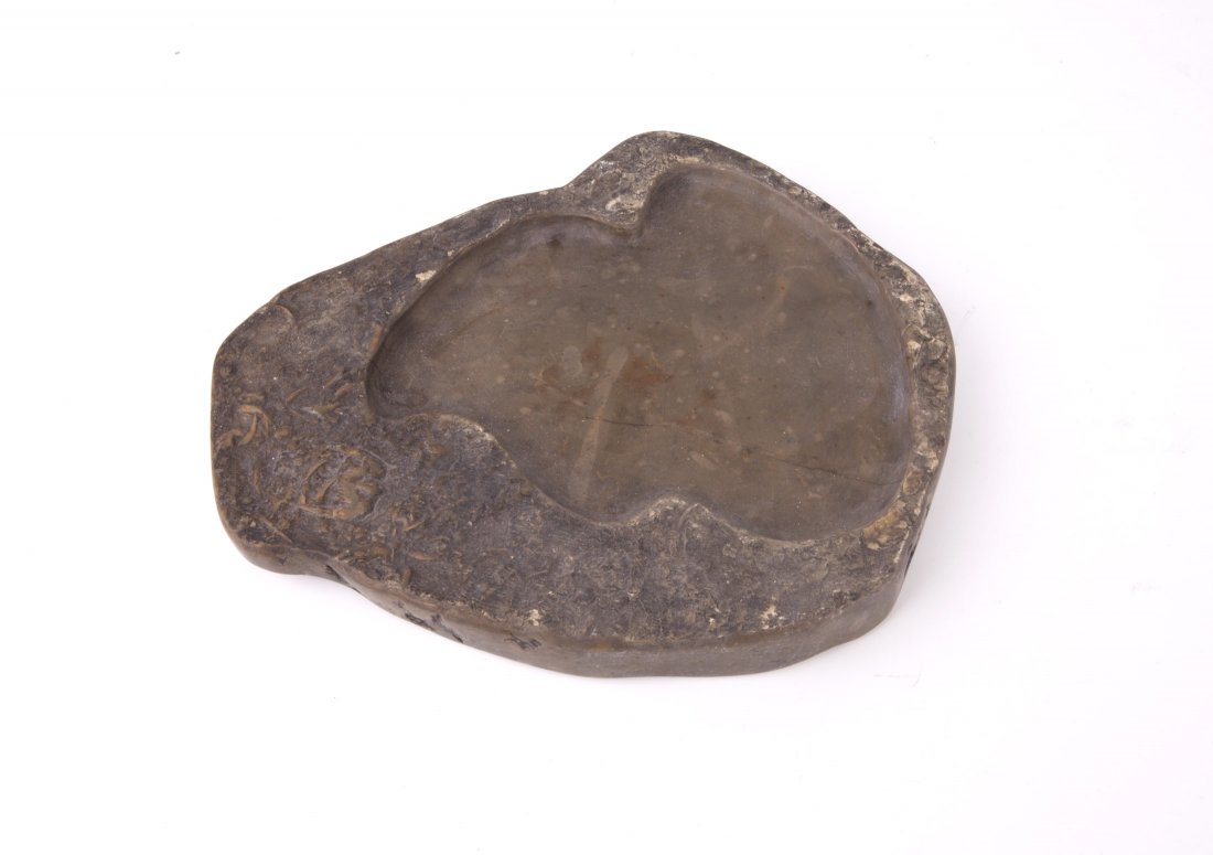 Chinese Fossil Inkstone: Chinese fossil inkstone of irregular shape.