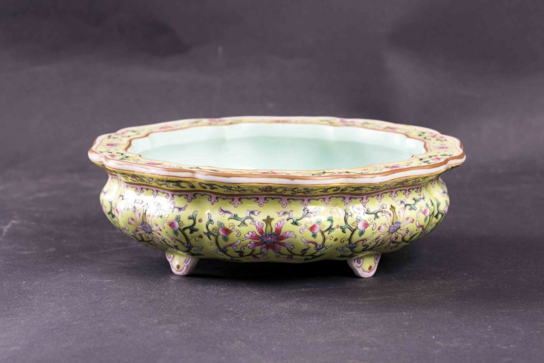 Chinese Famille Rose Porcelain Censer: Gorgeous Chinese famille rose enameled incense burner, with the design of continuous vivid flower and peach patterns on yellow ground, raised on four flat short feet with ruyi head enameled on each fe