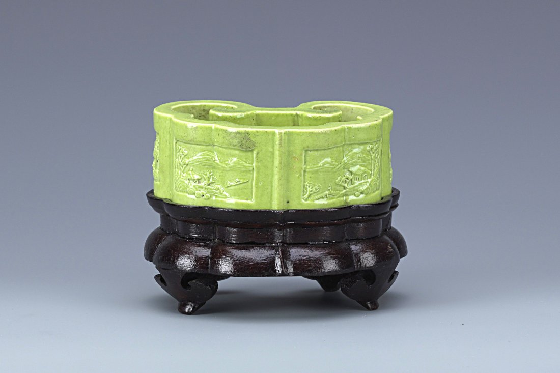 Chinese Green Glazed Porcelain Washer: Rare Chinese Green Glazed Porcelain Brush Washer with wooden stand raised on four carved foot, of Ruyi shape, carved detailing of four picturesque landscape painting on the exterior sides with inscrib
