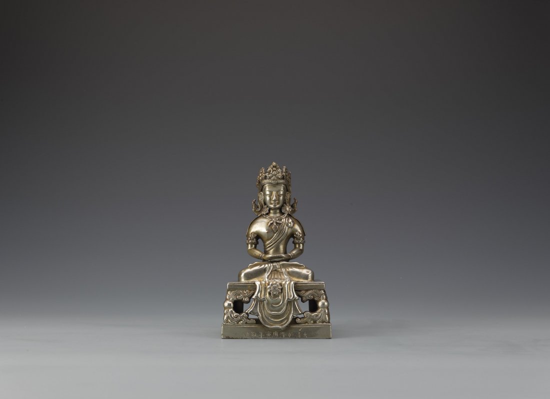 Gilt-Bronze Gold & Silver Amitayus Buddha sculpture,: Gilt-bronze Amitayus Sculpture seated in dhyanasana on a double layered square shaped throne, wearing an ornate headdress. The base of the throne is inscribed with Qian Long period. Length 4.5'' Width