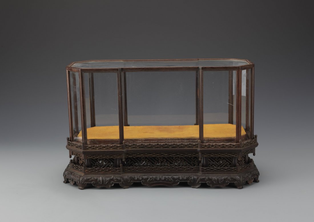 Zitan Wood Framed Glass Display Case: Zitan Wood Framed Glass Display Case. Mounted on a double layered detachable base. Ideal for containing precious items such as gems or fine artifacts. Length 17.5" Width 7" Height 10.75"