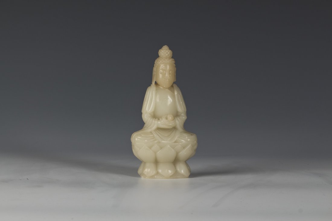 Fu Rong Soapstone Guan Yin: Fu Rong Soapstone Guan Yin with exquisite carving and vivid details. Guan Yin sits on a lotus and holding a flower. Width 2.5" Height 5"