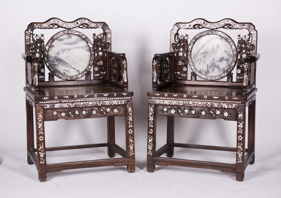 Pair of Rosewood/ Hardwood Armchair: Pair of Rosewood / Hardwood Armchair with exquisite Chinese traditional auspicious patterns carving. Chair back inlaid with a circular soapstone. Surface decorated by numerous shells pattern. Length 2