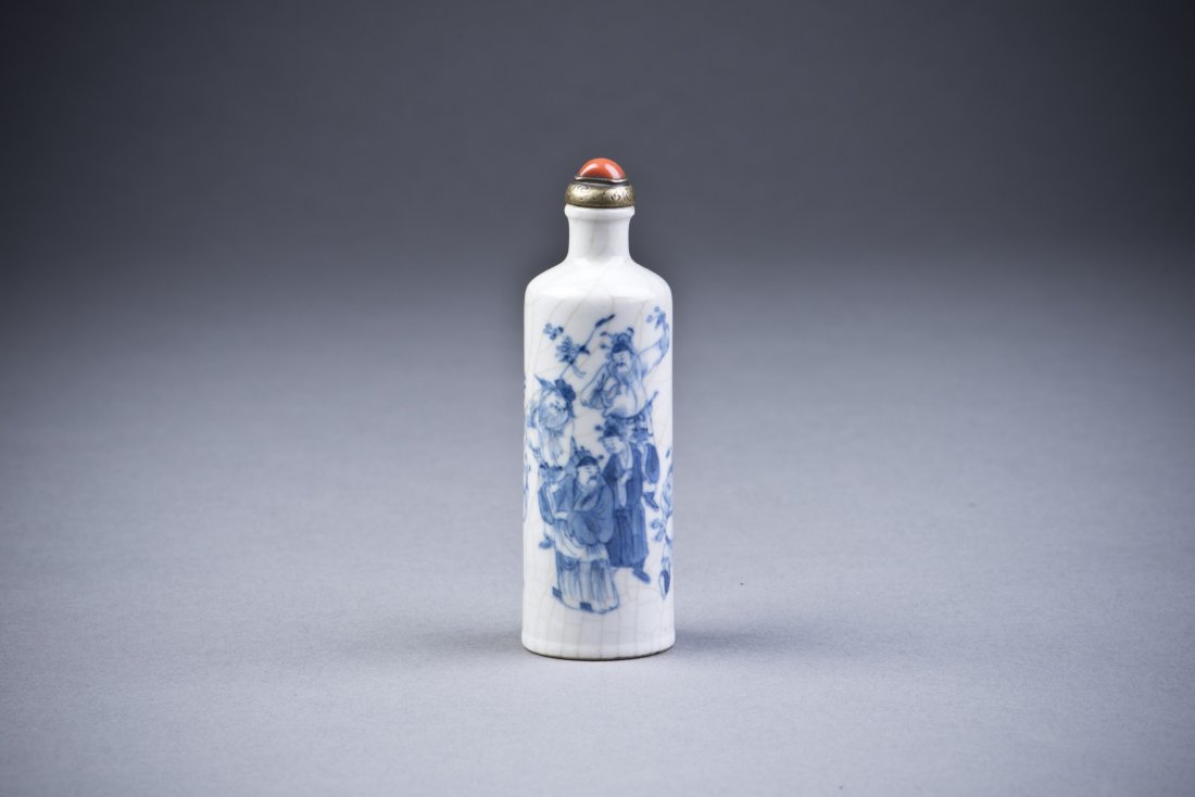 Blue & White Porcelain Snuff Bottle: A Blue & White Porcelain Snuff Bottle, cylindrical, painted with ancient Chinese scholars in celebration of harvest. Fine crackle glaze background with a coral toned cap and metal rim. Unglazed base. 