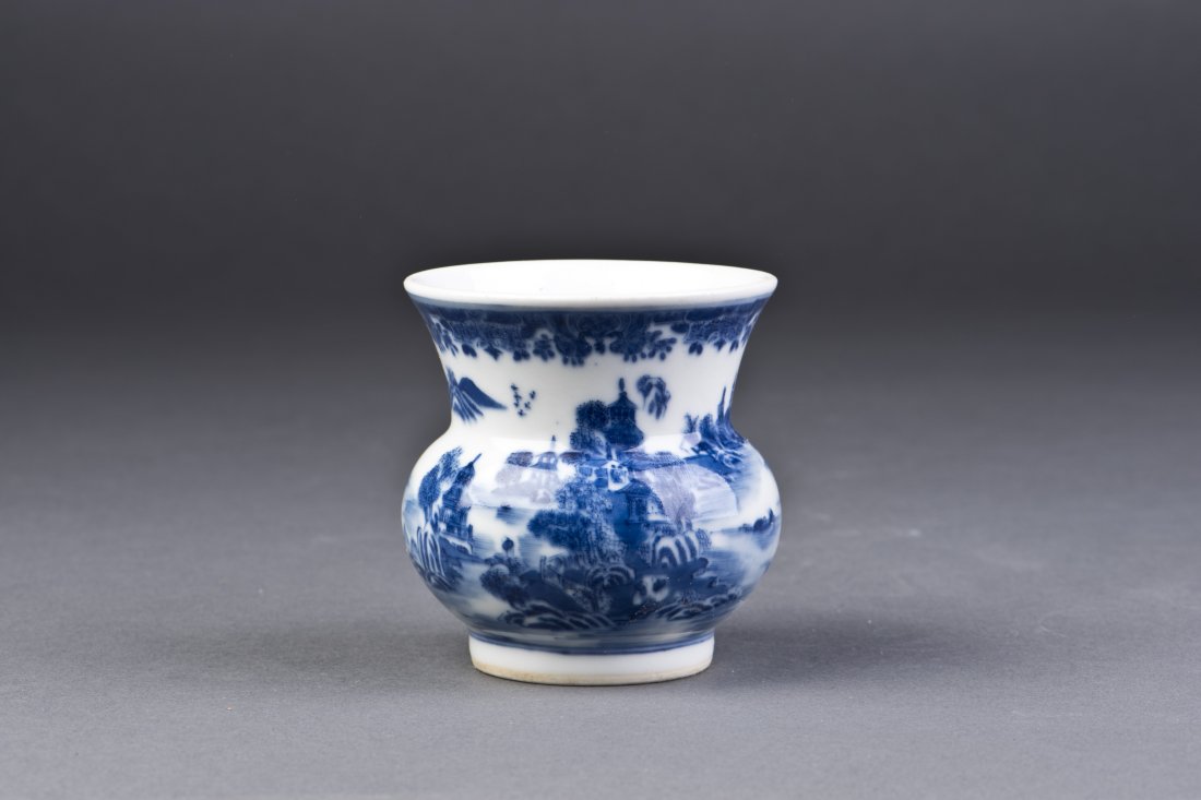 Blue & White Porcelain: Cobalt Blue & White Porcelain Spittoon, featuring lush Chinese mountside lanscapes with mountain retreats birds of air and arboreal detailing. Slightly raised, recessed base. Six character seal imprin