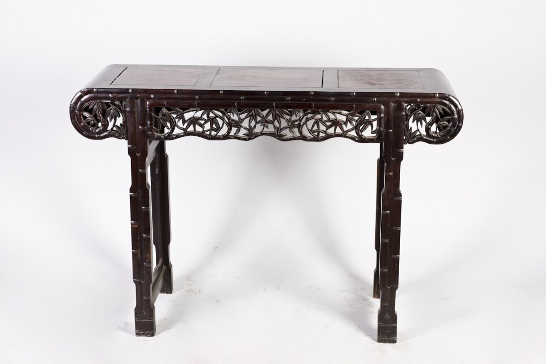 A Hardwood Altar Table Designed with Bamboo Features: A unique hardwood alter table featuring aprons carved in bamboo leaf form and four legs in bammboo stem form. Length 48.75" Width 15.75" Height 33.75"