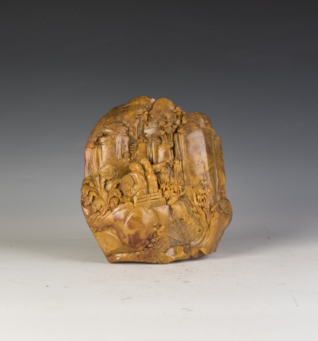 A SOAPSTONE LANDSCAPE SCULPTURE: A soapstone(Balin stone) of elaborate landscape of two sages traveling in the mountain scenery. Height 7.5" Length 7" Width 3.25"