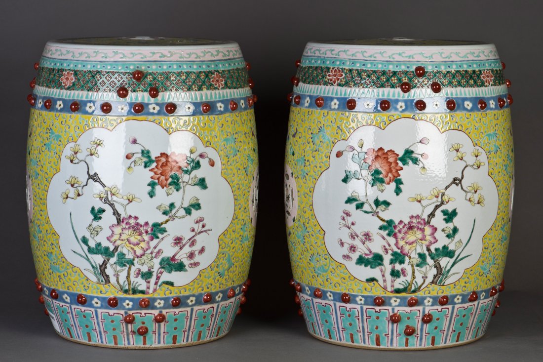 A PAIR OF CHINESE FAMILLER ROSE PORCELAIN STOOLS: Pair of Chinese Famille Rose Porcelain Stool, with beautifully painted, White ground. The painting is describes Chinese classical blooming flower. Height18" Diameter14"