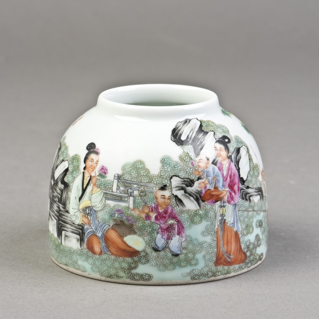 A PORCELAIN WATER POT OF FIGURAL MOTIF: The classic Chinese porcelain water pot features narrative painting of ladies and their songs playing in the yard with rockery and pine trees, inscribed, signed with two red seals on one side, a six-c