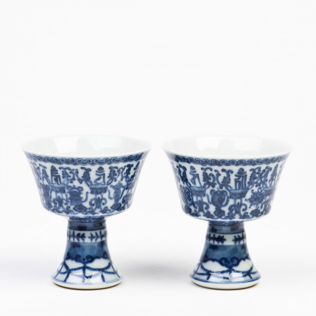 A PAIR OF BLUE AND WHITE STEMCUPS: A PAIR OF BLUE AND WHITE STEMCUPS Height 3.25 in. (8.255 cm.) Width 3 in. (7.62 cm.)
