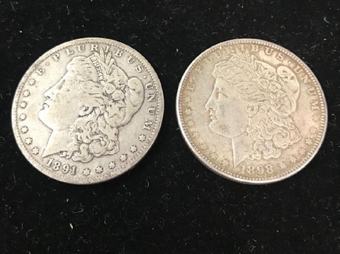 2 MORGAN SILVER DOLLARS INCLUDING 1891 (TAPED) AND 1898 (1 of 2)