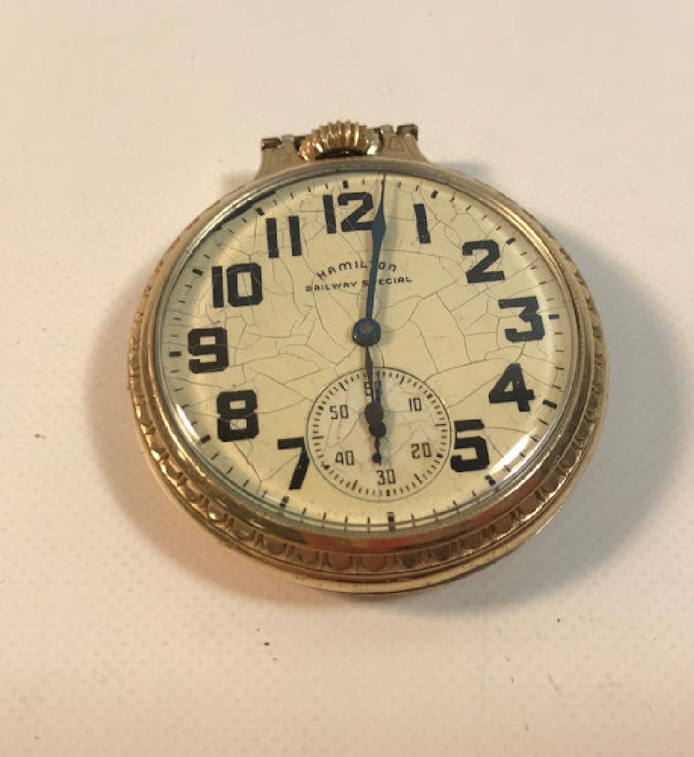 HAMILTON POCKET WATCH ~ RAILWAY SPECIAL. GOLD TONE: HAMILTON POCKET WATCH ~ RAILWAY SPECIAL. GOLD TONE METAL CASE (GOLD-FILLED)FROM WADSWORTH NUMBERED H676064. OFF-WHITE FACE W/NUMERIC INDICATORS (FACECRACKED/CRAZED). 21-JEWEL MOVEMENT NUMBERED C251635