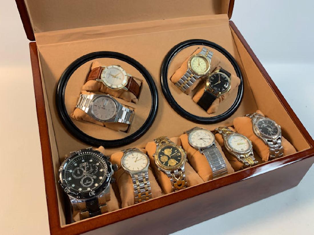 WATCH CASE W/WATCHES ~ CASE 9.25" X 12.5" IN SIZE. TEN: WATCH CASE W/WATCHES ~ CASE 9.25" X 12.5" IN SIZE. TEN WATCHES W/STYLES FROM LORDNELSON, SEIKO, BENSON ELECTRA, TIMEX, AND INVICTA. CASE CONTAINS TWO MOTORIZEDSPINNING DISPLAYS (W/CORD).