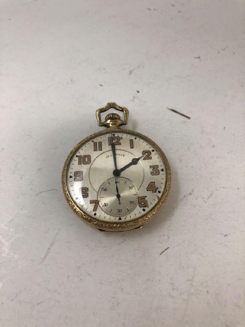 ILLINOIS POCKET WATCH ~ 1.625" IN DIAMETER. SILVER TONE: ILLINOIS POCKET WATCH ~ 1.625" IN DIAMETER. SILVER TONE FACE W/COPPER TONE NUMERICINDICATORS. MONOGRAMMED REVERSE. WARRANTED 25 YEAR CASE FROM WADSWORTH. 21-JEWEL MOVEMENT W/5 POSITIONS NUMBERED 36994
