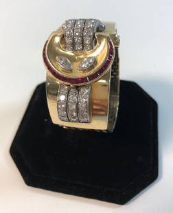 14KT GOLD WATCH BAND ~ MISSING FACE. STAMPED "5075".: 14KT GOLD WATCH BAND ~ MISSING FACE. STAMPED "5075". FOLDOVER CLASP CLOSURE. 79.9GRAMS TW. INSET DIAMONDS AND RUBIES. POLISHED FINISH. 5.5" IN LENGTH. RUBIES AREDARK RED IN COLOR WITH MINIMAL INCLUSIO