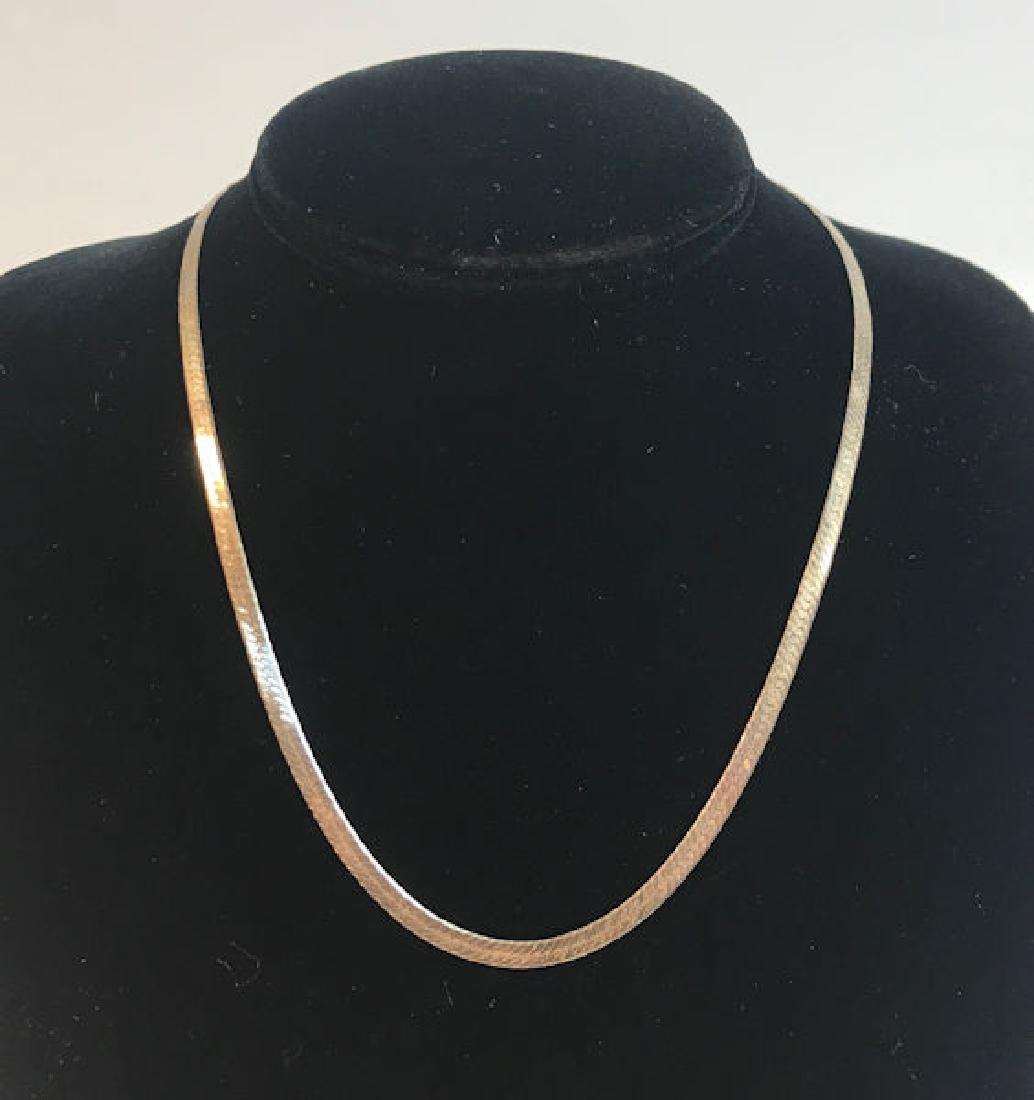 SILVER NECKLACE ~ STERLING SILVER HERRINGBONE CHAIN: SILVER NECKLACE ~ STERLING SILVER HERRINGBONE CHAIN NECKLACE (LOBSTER HOOKCLASP CLOSURE). 16" CHOKER LENGTH NECKLACE. ITALIAN MADE SIGNED "HCT". 0.285 TROYOUNCES TW.