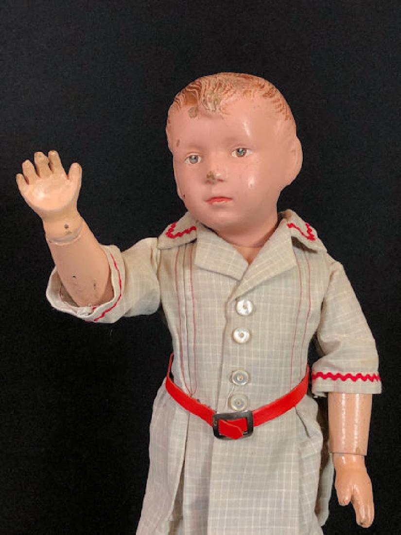 16" SCHOENHUT ALL WOOD CARVED HAIR CHARACTER BOY.: 16" SCHOENHUT ALL WOOD CARVED HAIR CHARACTER BOY. INCISED SCHOENHUT MARK ON UPPER CENTER BACK. INTAGLIO EYES AND CLOSED MOUTH WITH SPRING JOINTED BODY. NICELY REDRESSED.