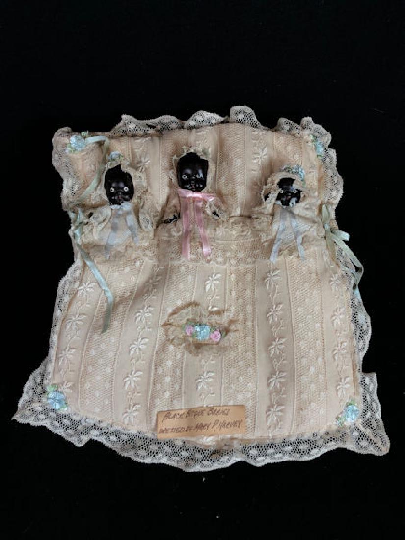 ANTIQUE ALL BISQUE BABY DISPLAY PILLOW. (3) BLACK DOLLS (1 of 3)