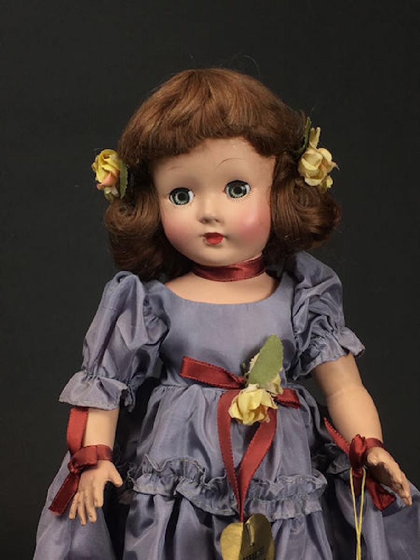 14" EFFANBEE "HONEY" ALL ORIGINAL HARD PLASTIC DOLL.: 14" EFFANBEE "HONEY" ALL ORIGINAL HARD PLASTIC DOLL. TAFFETA GOWN AND MATCHING PANTIES. FLOWERS IN HER HAIR THAT MATCH THOSE AT WAIST. ALSO MATCHING RIBBONS AROUND HER NECK, WAIST AND WRISTS. ORIGINAL