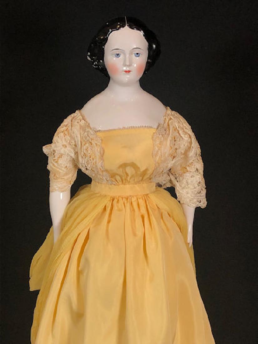 23" CHINA HEAD WITH JENNY LIND HAIRSTYLE. PAINTED AND: 23" CHINA HEAD WITH JENNY LIND HAIRSTYLE. PAINTED AND MOLDED HAIR AND FACIAL FEATURES, STITCH JOINTED FIRMLY STUFFED BODY WITH CHINA LOWER ARMS AND LEGS WITH FANCY LIGHT GOLD LUSTRE BOOTS. BODY IS JOI