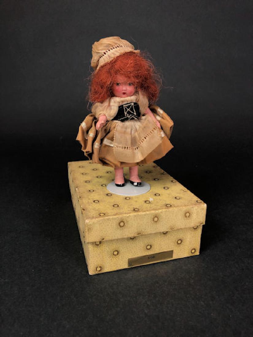 5" STORYBOOK DOLL IN ORIGINAL COSTUME AND YELLOW: 5" STORYBOOK DOLL IN ORIGINAL COSTUME AND YELLOW SUNBURST BOX. "MADE IN JAPAN" MARK ON JOINTED PT BISQUE BODY, MOLDED BANGS, MOLDED SOCKS AND GOLD FOIL LABEL ON BOX "IRISH" #34. CIRCA 1930'S - LATE.