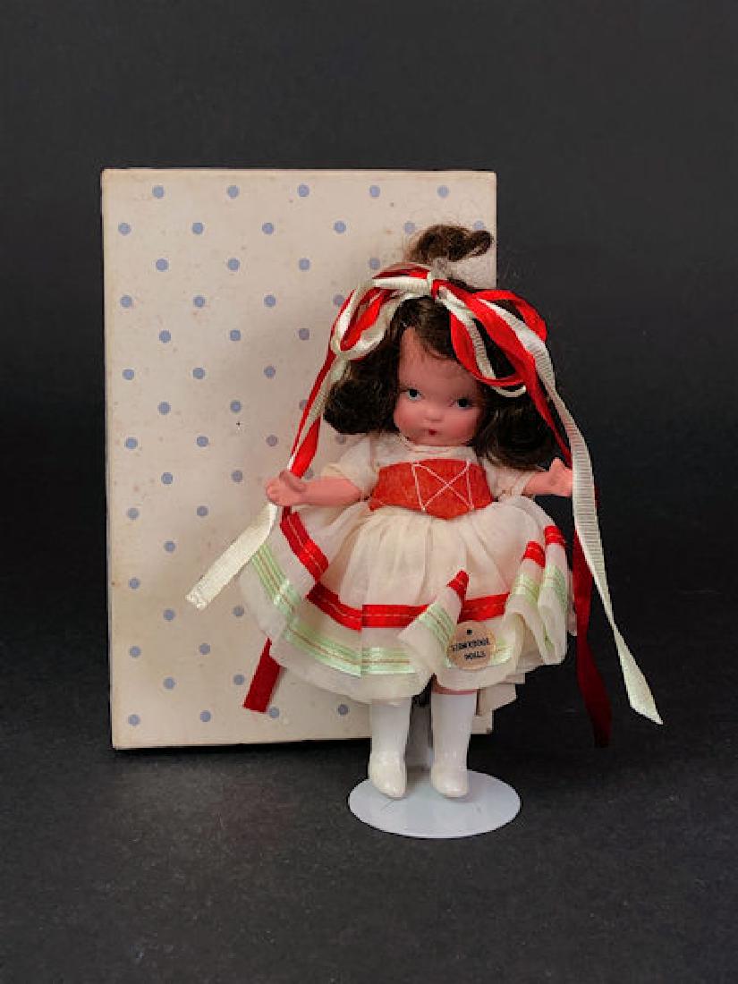5½" STORYBOOK DOLL IN ORIGINAL COSTUME. "STORY: 5½" STORYBOOK DOLL IN ORIGINAL COSTUME. "STORY BOOK DOLL USA" MARK ON JOINTED PT BISQUE BODY WITH MOLDED BANGS, MOLDED SOCKS, TALL PAINTED WHITE BOOTS AND GOLD FOIL STICKER ON COSTUME "STORYBOO