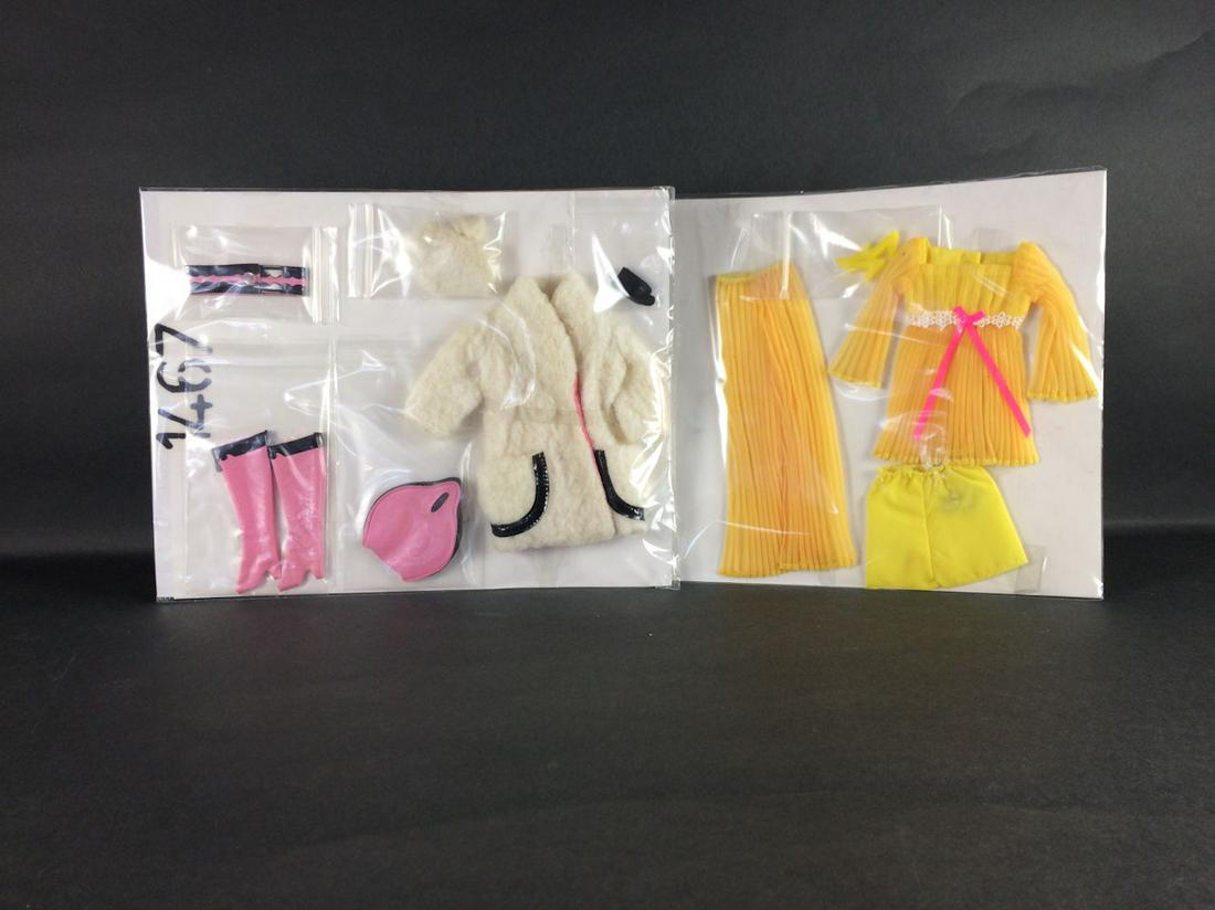 2 VINTAGE BARBIE OUTFITS INCLUDING "LEMON KICK" #1465: 2 VINTAGE BARBIE OUTFITS INCLUDING "LEMON KICK" #1465 (COMPLETE) AND "LAMB 'N LEATHER" #1467 (MISSING ONE GLOVE). BOTH ARE IN UNPLAYED WITH CONDITION.