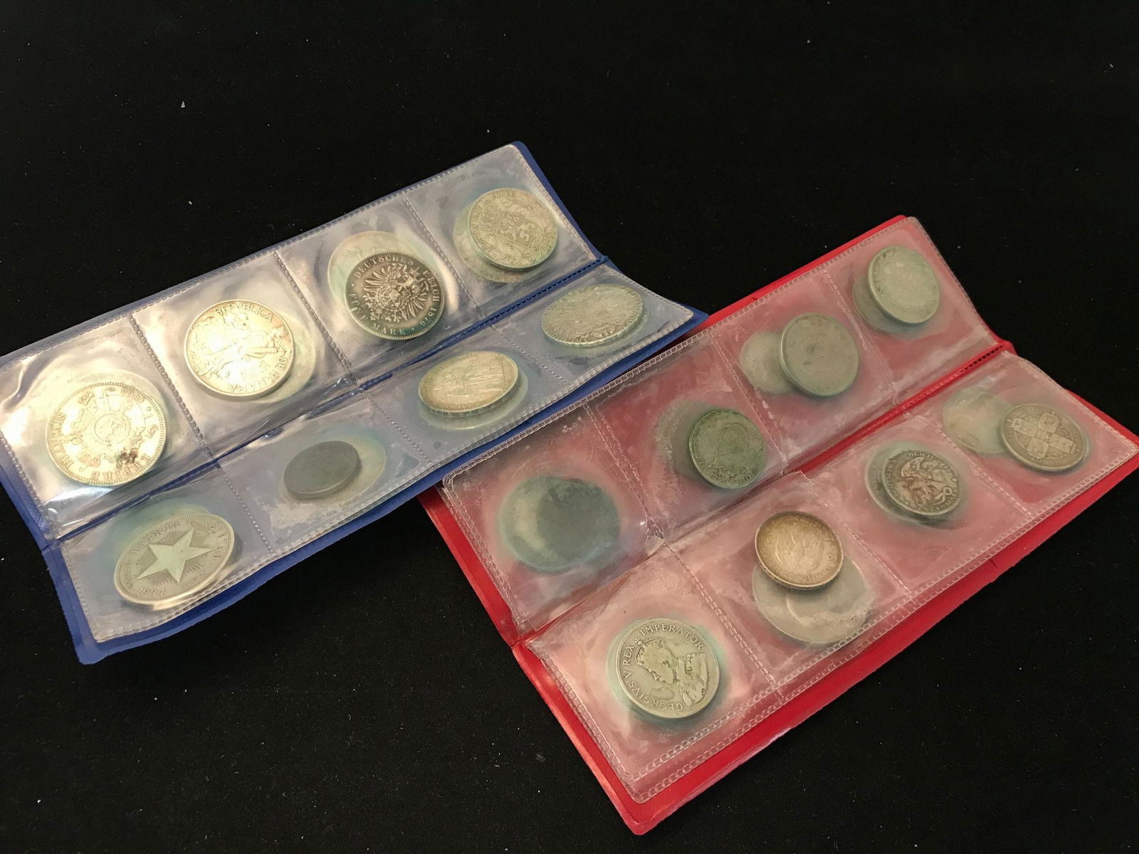 2 COIN FOLDERS WITH 31 FOREIGN COINS, SOME SILVER, (1 of 1)