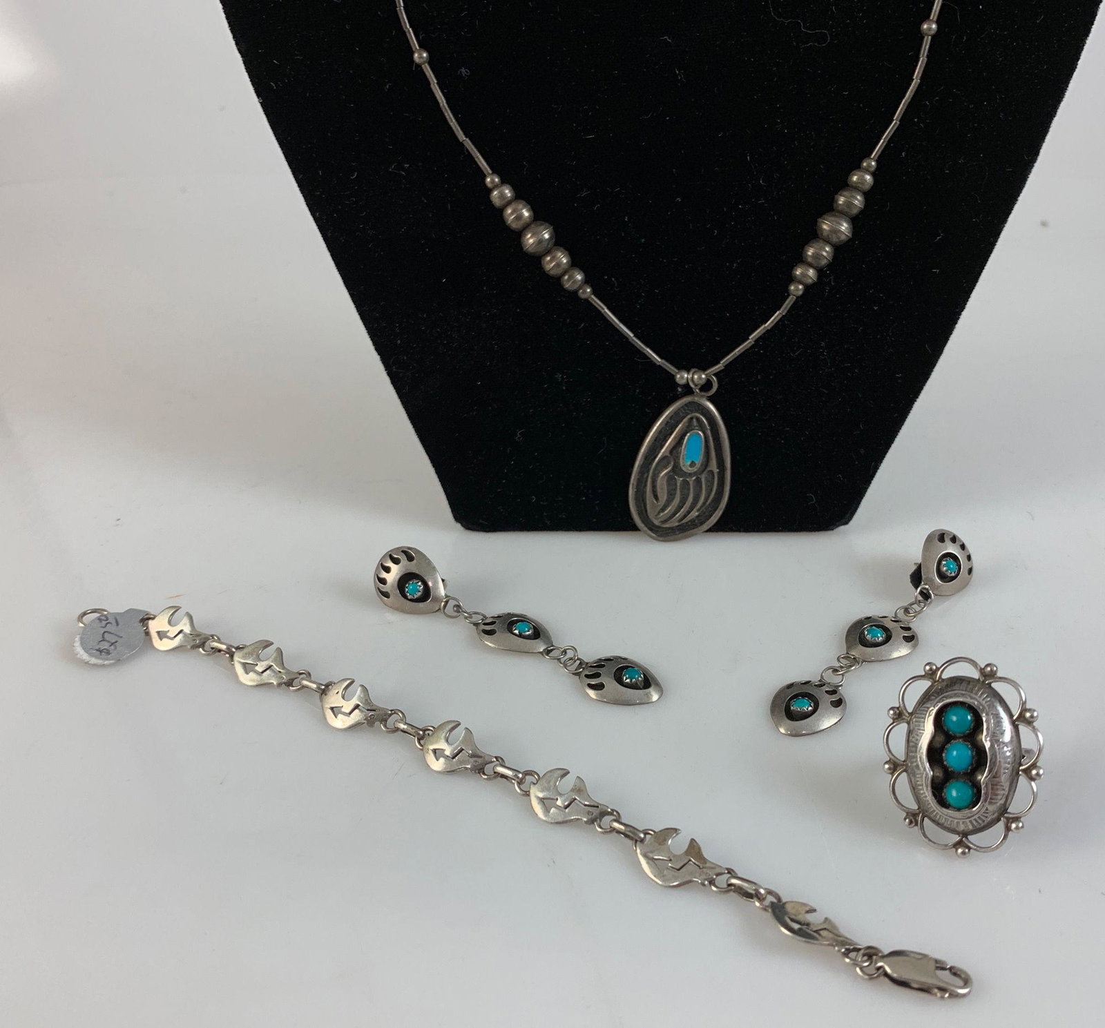 SOUTHWESTERN STYLE JEWELRY: SOUTHWESTERN STYLE JEWELRY ~ SS SIZE 6.5 STRAIGHT SHANK RING W/ SCALLOPED EDGEWORK & THREE BLUE STONE CABOCHONS IN ETCHED MOUNT, PR. COIN SILVER GRADE DANGLE EARRINGS 2.75" W/ POST BACKS & BEAR CLAW M