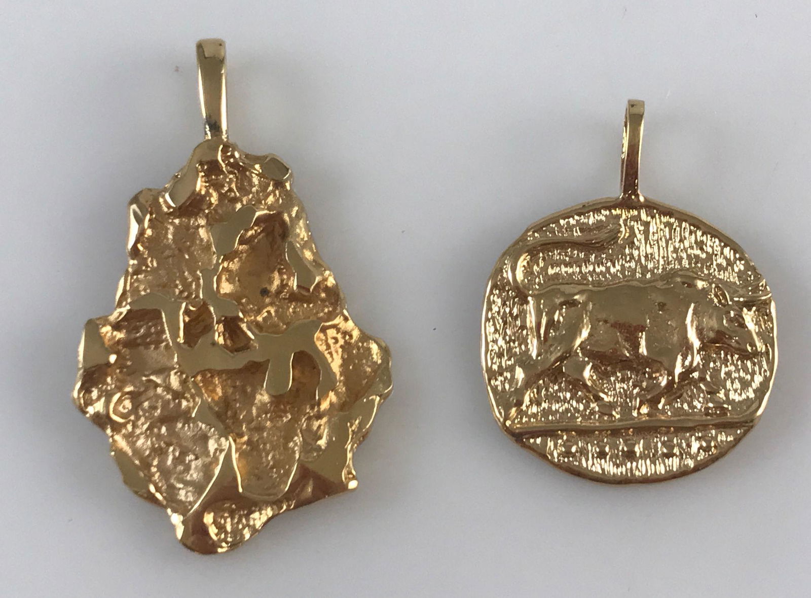TWO GOLD TONE PENDANTS (1 of 3)