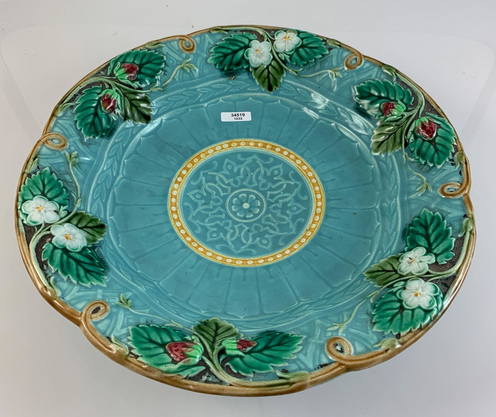 SARREGUEMINES FRENCH MAJOLICA FOOTED 12¼&: SARREGUEMINES FRENCH MAJOLICA FOOTED 12¼&Prime; BOWL IN TURQUOISE WITH GREEN LEAVES, BERRIES AND FLOWERS. VERY GOOD CONDITION