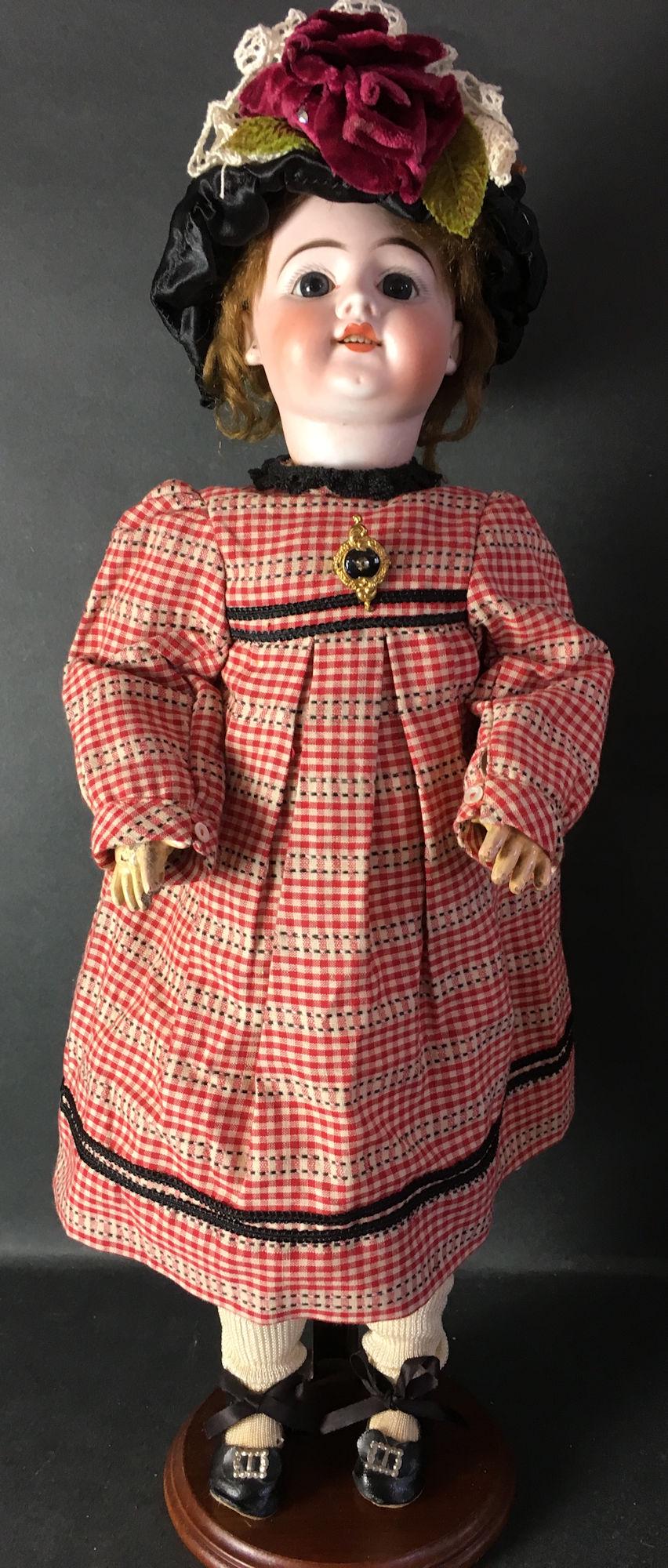 20" FRENCH BISQUE HEAD WALKER. MARKED "K" AT BASE OF: 20" FRENCH BISQUE HEAD WALKER. MARKED "K" AT BASE OF HEAD, SLANT CUT OPENING AS SHOWN, MOHAIR WIG ON CORK PATE, STATIONARY GLASS EYES, PIERCED EARS, OPEN MOUTH WITH TEETH, ON COMPOSITION WALKER BODY.