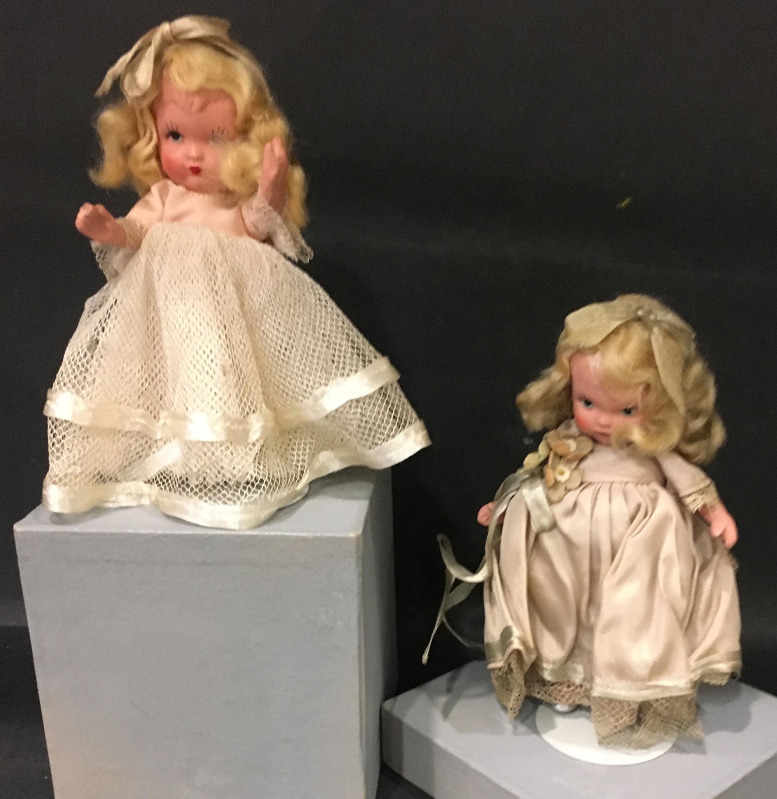 (2) EARLY NANCY ANN STORYBOOK FAMILY SERIES DOLLS IN: (2) EARLY NANCY ANN STORYBOOK FAMILY SERIES DOLLS IN ORIGINAL COSTUMES. 5½" "BRIDESMAID" #87 WITH "AMERICA" MARK ON JOINTED PT BISQUE BODY WITH MOLDED BANGS/SOCKS AND SILVER SLIPPERS. 5" POSSIB