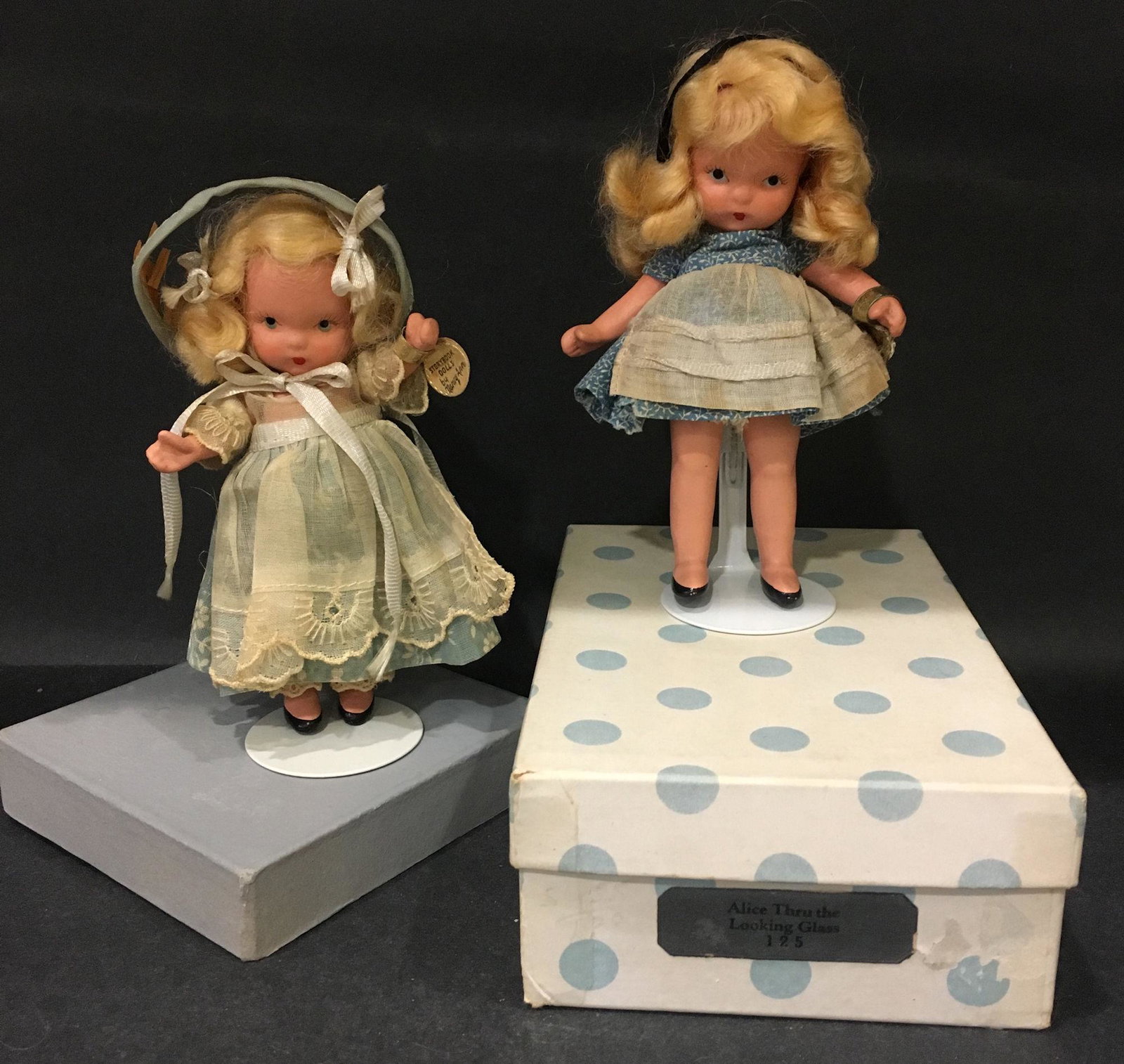 (2) 5½" STORYBOOK DOLLS IN ORIGINAL COSTUMES.: (2) 5½" STORYBOOK DOLLS IN ORIGINAL COSTUMES. FAIRYLAND SERIES "MARY HAS A LITTLE LAMB" #152 AND MOTHER GOOSE/FAIRY TALE SERIES "ALICE IN WONDERLAND" #125. "STORY BOOK DOLL USA" MARK ON JOINTED