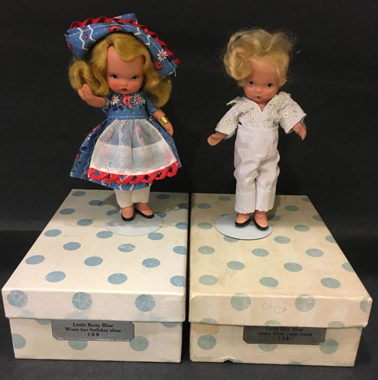 (2) 5½" STORYBOOK DOLLS MOTHER GOOSE/FAIRY TALE: (2) 5½" STORYBOOK DOLLS MOTHER GOOSE/FAIRY TALE SERIES IN ORIGINAL COSTUMES. "STORY BOOK DOLL USA" MARK ON JOINTED PT BISQUE BODIES. "LITTLE BETTY BLUE WORE HER HOLIDAY SHOE" #109 AND "LITTLE B